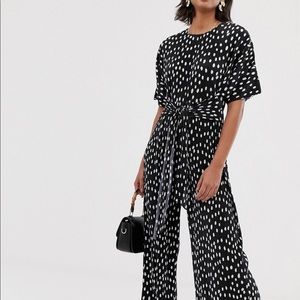 ASOS DESIGN plisse tie front jumpsuit in polka dot
